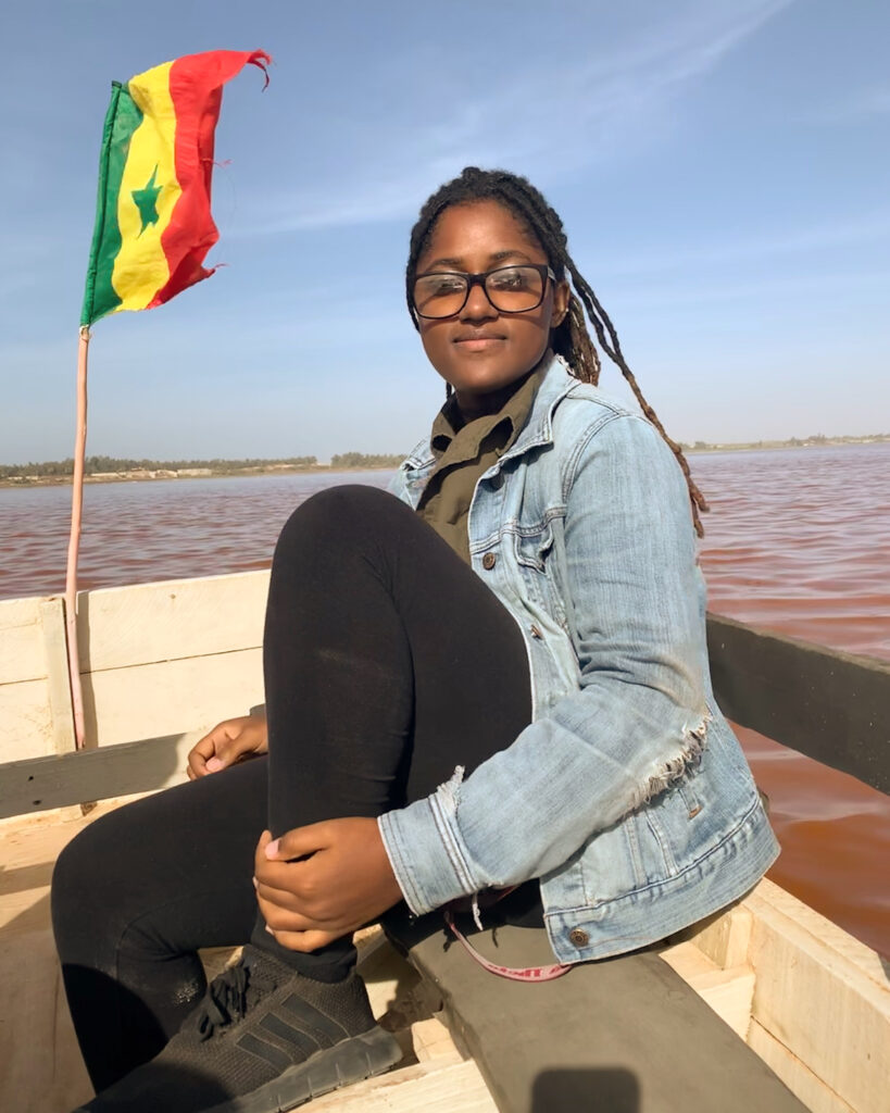 Janelle on a boat in the Pink Lake of Senegal